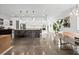 Modern open kitchen with stainless steel appliances and a large island with bar seating at 2305 Pine Ter, Sarasota, FL 34231