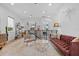 Bright upstairs living area with leather sofa, modern lighting, stylish decor, and hardwood floors at 2305 Pine Ter, Sarasota, FL 34231