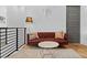 Cozy upstairs living area with leather sofa, modern lighting, and stylish decor accents at 2305 Pine Ter, Sarasota, FL 34231