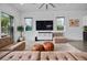 Comfortable living room with large windows and view of pool and backyard at 2305 Pine Ter, Sarasota, FL 34231