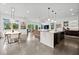 Spacious open-concept living area with contemporary design, dining space, and stylish decor at 2305 Pine Ter, Sarasota, FL 34231