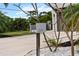 Modern mailbox with house number, complemented by beautiful landscaping and a well-maintained driveway at 2305 Pine Ter, Sarasota, FL 34231