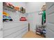 Bright walk-in closet with ample storage and shelving, perfect for organizing your wardrobe and accessories at 2305 Pine Ter, Sarasota, FL 34231
