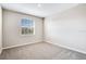 Bedroom features natural light and neutral carpeting at 23445 Collina Way # 10103, Port Charlotte, FL 33980