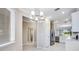 Bright kitchen with stainless steel appliances, white cabinets, and a view to the outside at 23445 Collina Way # 10103, Port Charlotte, FL 33980