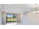 Living room features an outdoor view and recessed lighting at 23445 Collina Way # 10103, Port Charlotte, FL 33980