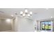 Living room features recessed lighting and an outdoor view at 23445 Collina Way # 10103, Port Charlotte, FL 33980