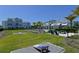 Recreational area with cornhole and picnic tables, perfect for socializing within the community at 2401 Ezzell Ct, Sarasota, FL 34237