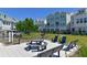 Community gathering area with picnic tables, benches, and grills, ideal for outdoor activities and socializing at 2401 Ezzell Ct, Sarasota, FL 34237