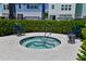 Relaxing community hot tub surrounded by lush greenery and comfortable seating, ideal for unwinding at 2401 Ezzell Ct, Sarasota, FL 34237
