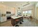 Open concept kitchen featuring bar stool seating, stainless appliances, and views of living room at 2401 Ezzell Ct, Sarasota, FL 34237