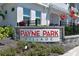 Payne Park Village signage with colorful vegetation creates a welcoming entrance to the community at 2401 Ezzell Ct, Sarasota, FL 34237