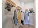 Bright walk-in closet with wire shelving and hanging rods provides ample storage space at 2401 Ezzell Ct, Sarasota, FL 34237