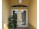 Elegant double front door with transom window and decorative hardware at 2874 56Th Avenue E Cir, Bradenton, FL 34203