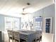 Well-lit dining area with a striped tablecloth and coastal decor, perfect for Gathering meals at 3333 26Th E Ave # 1220, Bradenton, FL 34208