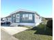 Inviting single-Gathering home with a well-kept lawn, carport, and a freshly painted exterior at 3333 26Th E Ave # 1220, Bradenton, FL 34208