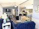 Open-concept living area with plush blue sofas, creating a comfortable and inviting space at 3333 26Th E Ave # 1220, Bradenton, FL 34208