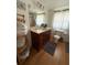 Well-lit bathroom with modern vanity, spacious mirror, and a shower cabin visible in the background at 35048 Condominium Blvd, Zephyrhills, FL 33541