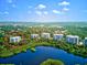 Stunning aerial view of the condos near lake at 3603 N Point Rd # 702, Osprey, FL 34229