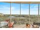 Spacious screened balcony offering panoramic views of the beautiful waterways and lush landscape at 3603 N Point Rd # 702, Osprey, FL 34229