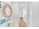 Bright bathroom featuring a pedestal sink, decorative mirror, and tiled accents at 3603 N Point Rd # 702, Osprey, FL 34229