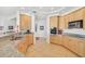 Well-lit kitchen featuring granite counters, stainless appliances and tan tile flooring at 3603 N Point Rd # 702, Osprey, FL 34229