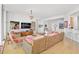 Spacious living room with hardwood floors, chandelier, and an entertainment center at 3603 N Point Rd # 702, Osprey, FL 34229