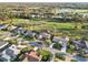 Aerial view of a residential area with golf course at 3876 Torrey Pines Blvd, Sarasota, FL 34238