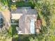 Aerial view of the property showing a well-maintained roof, landscaping, and possible pool area at 3876 Torrey Pines Blvd, Sarasota, FL 34238