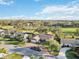 Residential street and golf course with lush trees at 3876 Torrey Pines Blvd, Sarasota, FL 34238