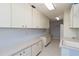 Functional laundry room area with lots of storage at 3876 Torrey Pines Blvd, Sarasota, FL 34238