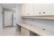 Functional office space with built-in desk and storage cabinets at 3876 Torrey Pines Blvd, Sarasota, FL 34238