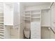 Spacious walk-in closet with custom shelving and storage solutions for optimized organization at 3876 Torrey Pines Blvd, Sarasota, FL 34238