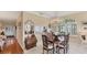 Elegant dining room featuring hardwood floors, chandelier, and lots of natural light at 3982 Chatsworth Greene # 37, Sarasota, FL 34235
