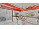 Well-lit kitchen with white cabinets, granite countertops, and an island with seating at 3982 Chatsworth Greene # 37, Sarasota, FL 34235