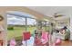 Inviting sunroom filled with natural light and views of the backyard at 3982 Chatsworth Greene # 37, Sarasota, FL 34235