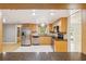 Well-lit kitchen with stainless steel appliances and wooden cabinets at 4021 Barry Way, Sarasota, FL 34232