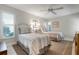 Charming bedroom with twin beds, neutral decor and plantation shutters at 4067 Wilshire E Cir # 131, Sarasota, FL 34238