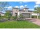 Charming home with lush landscaping, tiled roof, and a two-car garage at 4109 Cascina Way, Sarasota, FL 34238