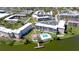 Aerial view showcasing a condo community with pool, lake access, and well-manicured landscaping at 4133 Heron Way # E202, Bradenton, FL 34205