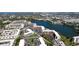 Expansive aerial view featuring the condo community, its proximity to the lake, and lush landscaping at 4133 Heron Way # E202, Bradenton, FL 34205
