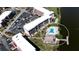 This aerial view highlights the condo, pool, parking, and proximity to the lake at 4133 Heron Way # E202, Bradenton, FL 34205