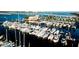 Stunning aerial view of the marina showcasing a luxurious harbor filled with boats and yachts, surrounded by picturesque scenery at 4133 Heron Way # E202, Bradenton, FL 34205