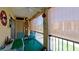 Relaxing balcony with chairs, table, and view of the surrounding landscape at 4133 Heron Way # E202, Bradenton, FL 34205