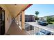Balcony view overlooking the parking lot and condo buildings in a well-maintained community at 4133 Heron Way # E202, Bradenton, FL 34205