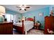 Charming bedroom featuring a ceiling fan, wood furniture, and a sliding glass door at 4133 Heron Way # E202, Bradenton, FL 34205