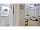 Bathroom and Bedroom View Featuring Well-Lit Space and Wood Furniture at 4133 Heron Way # E202, Bradenton, FL 34205