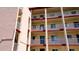 Exterior of condo building with multiple units and balconies at 4133 Heron Way # E202, Bradenton, FL 34205