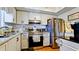 Well-lit kitchen featuring stainless steel appliances and ample counter space at 4133 Heron Way # E202, Bradenton, FL 34205