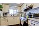 Stylish kitchen with white cabinets, modern appliances, and ample counter space at 4133 Heron Way # E202, Bradenton, FL 34205